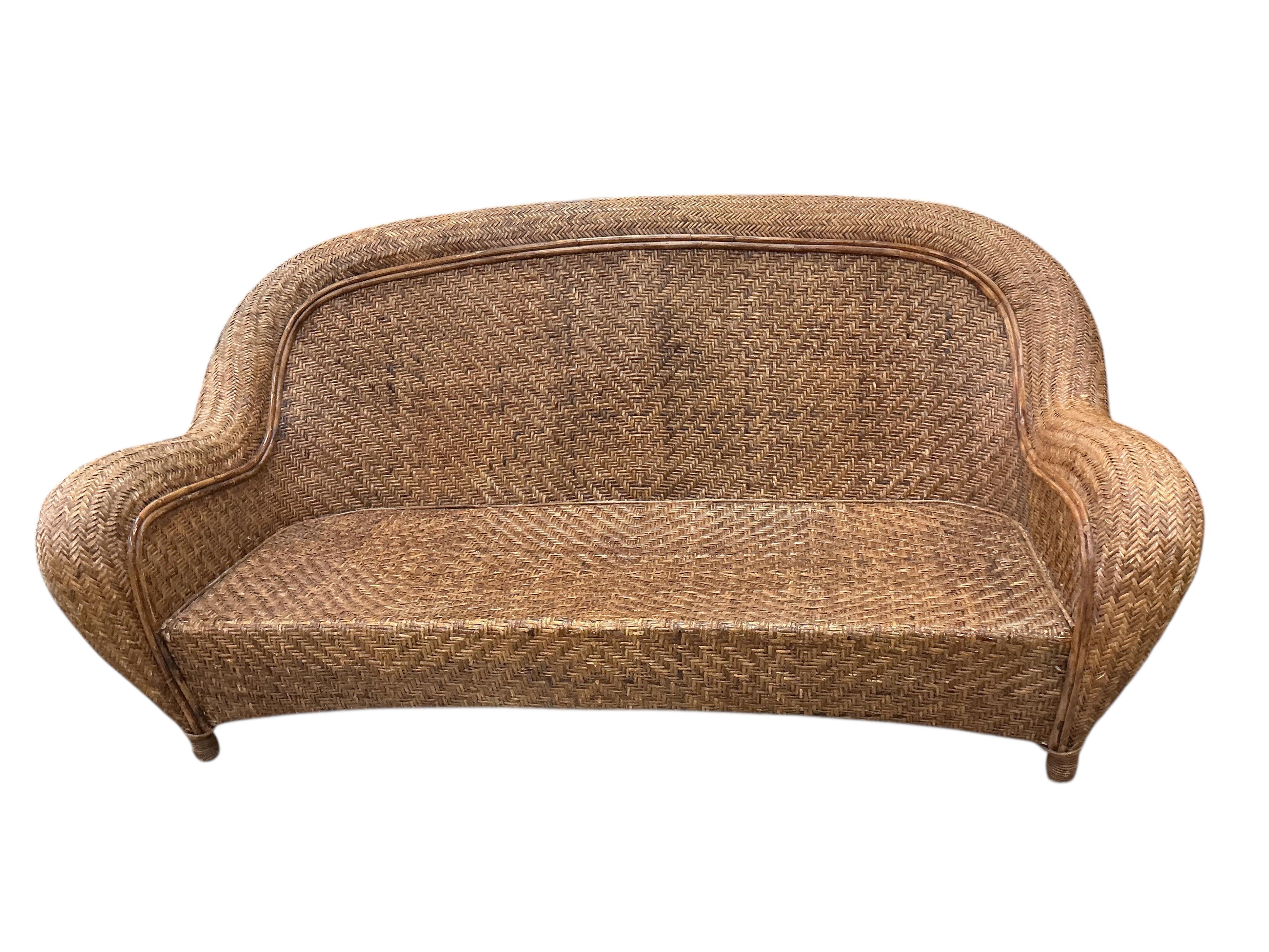 A rattan conservatory settee with associated cushion seat and back, width 186cm, depth 94cm, height 86cm